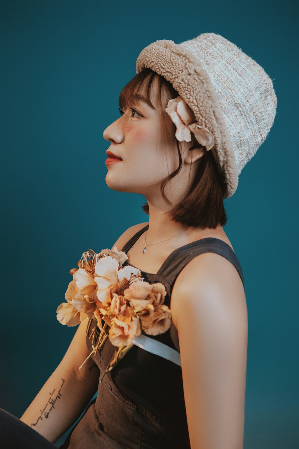 a woman with a flower in her hair