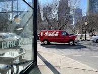 Kitchenfix service van parked outside a busy cafe, ready for chiller repair.