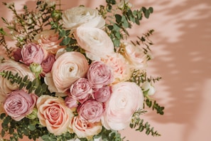 A beautifully arranged bouquet of flowers in soft hues.