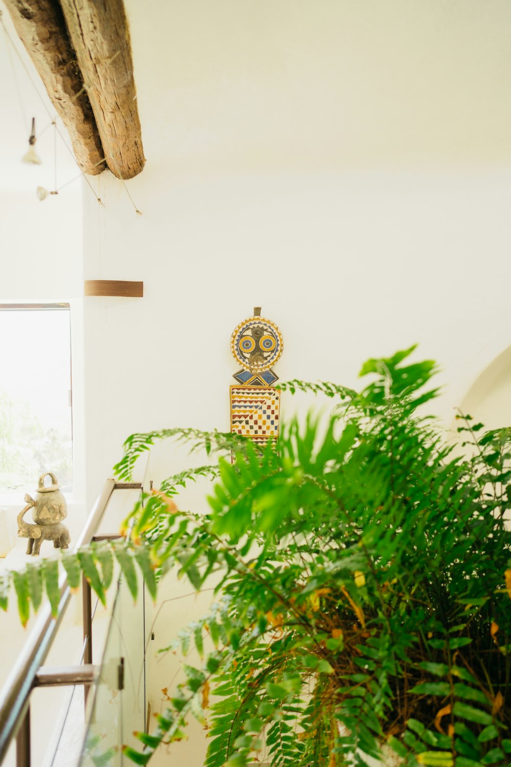 a plant in a pot sitting on a stair case