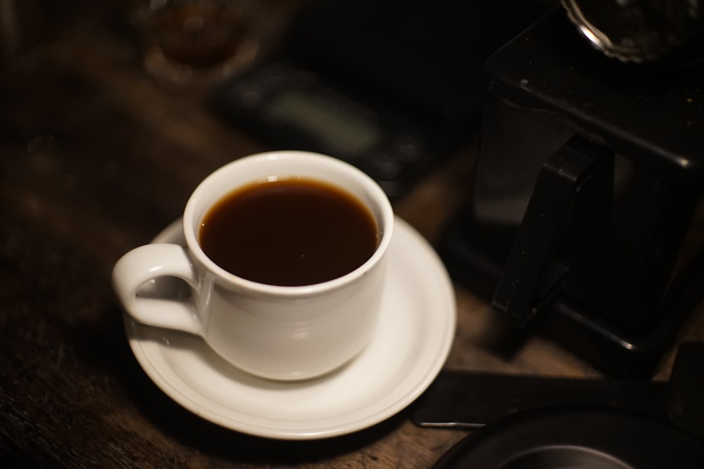 a cup of coffee sitting on top of a saucer