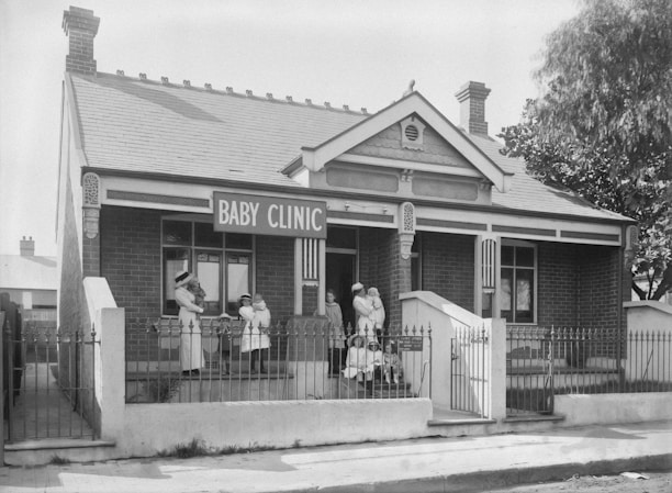 Historic black and white photo of Durgapur Club's original building with British officials.