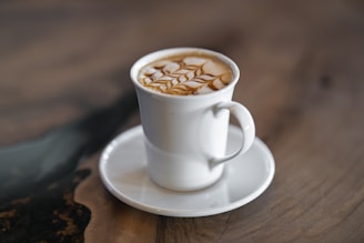 A stylish ceramic coffee cup featuring a QR code and custom artwork on a clean white background.