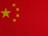 a close up of a red background with yellow stars