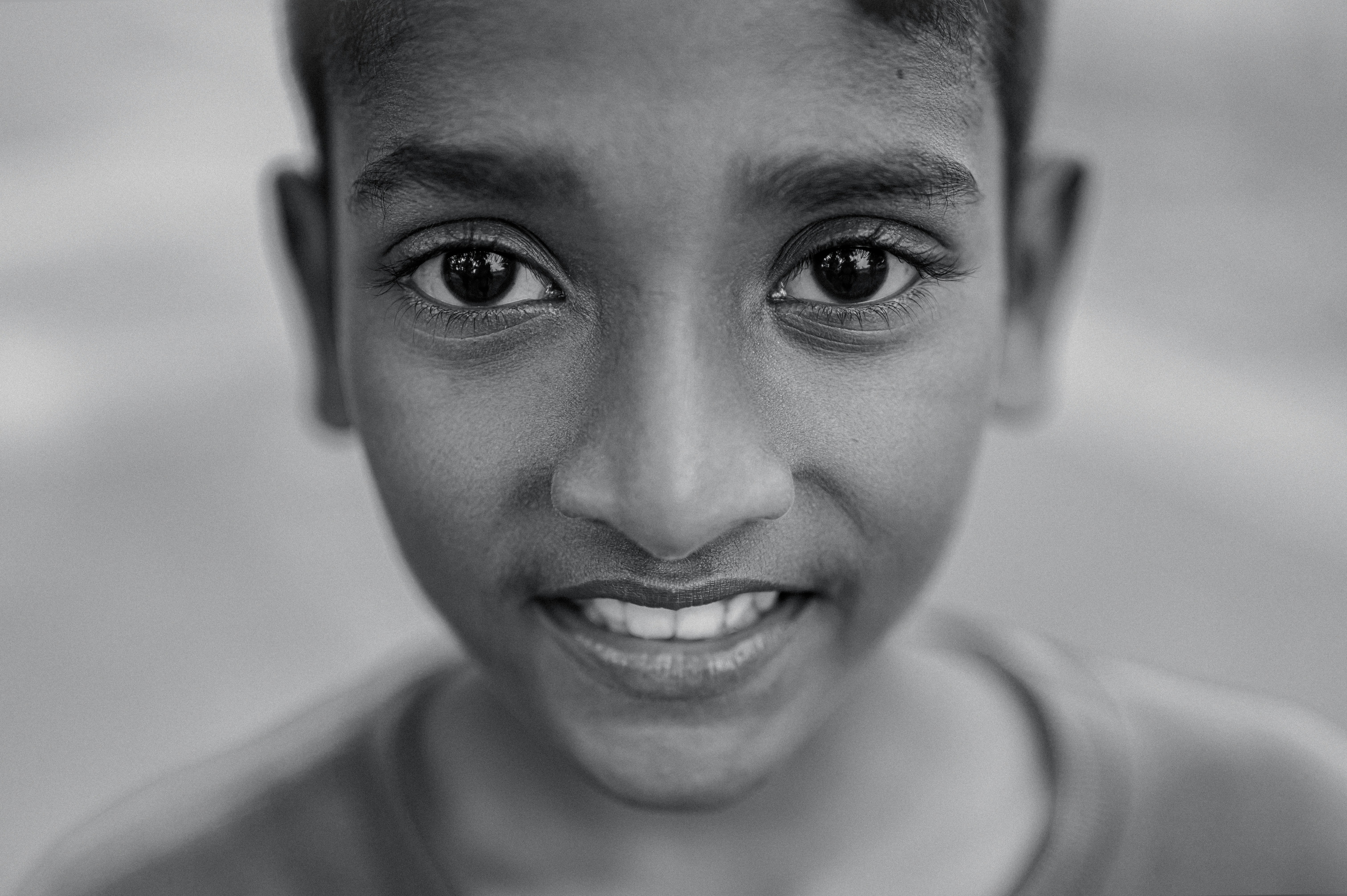 a black and white photo of a young boy