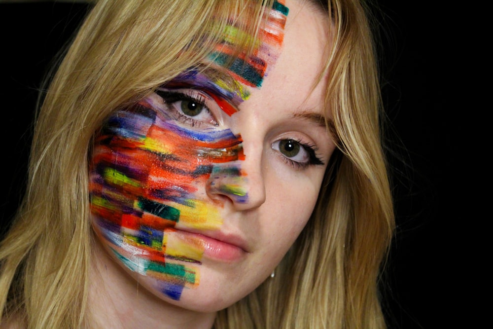 a woman with her face painted like a painting