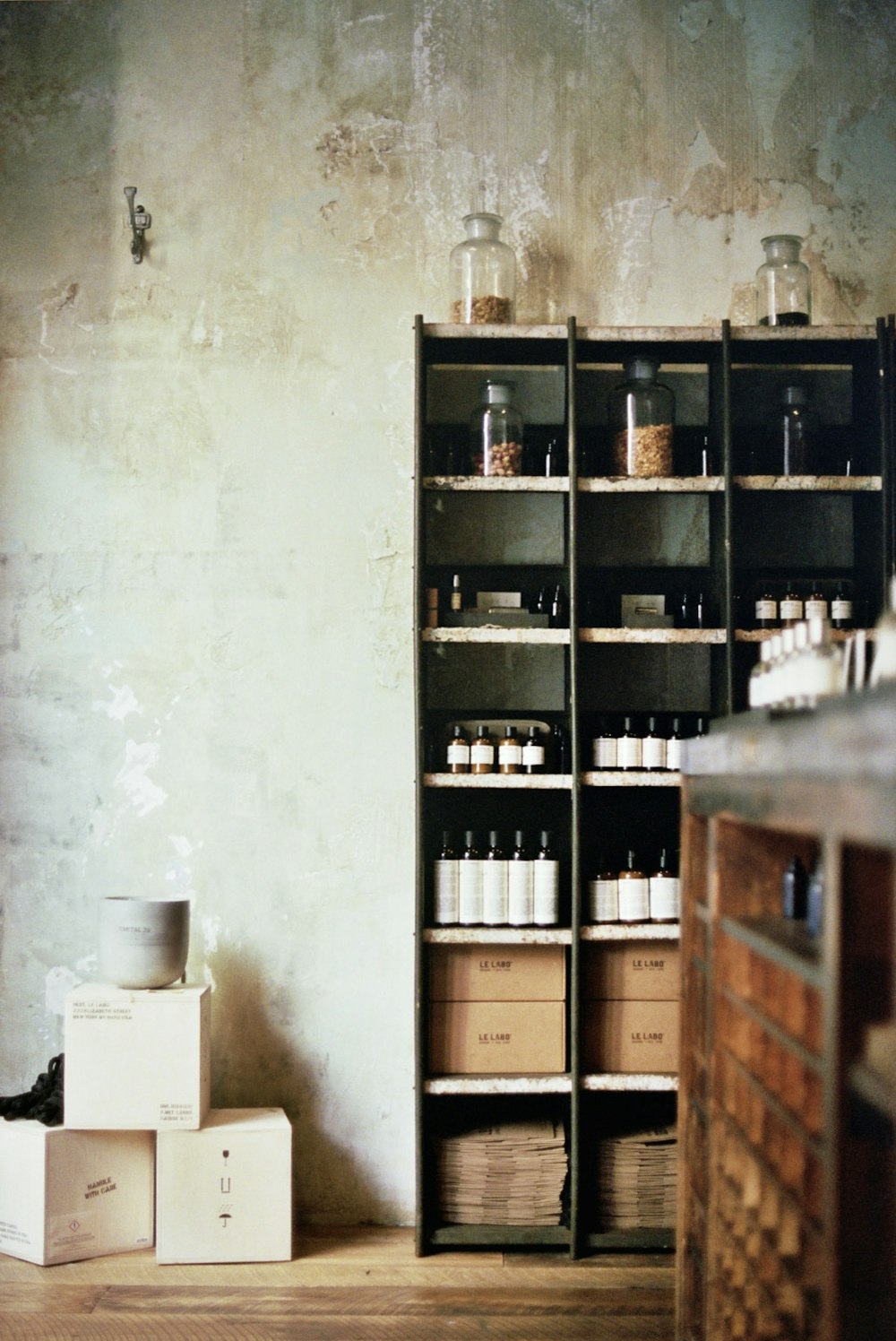 a room filled with lots of shelves filled with bottles