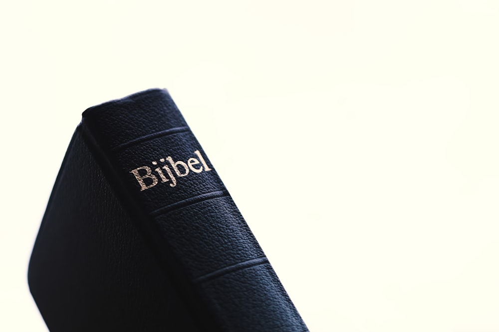 a close up of a bible on a table