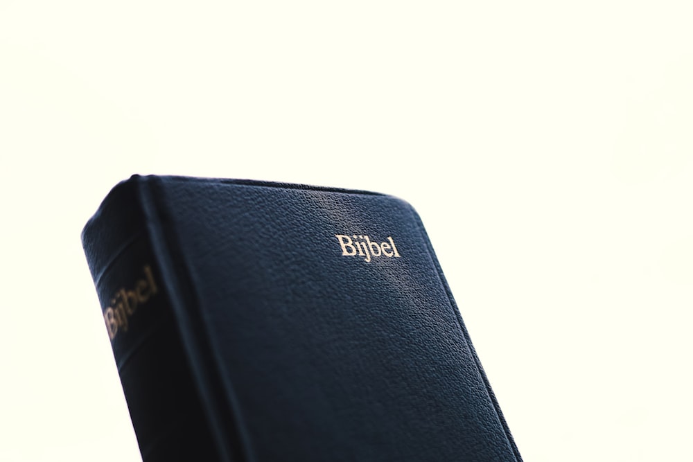 a close up of a book with a sky background