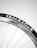 A close-up view of a bicycle wheel with the tire branded as 'thickslick'. The rim is metallic with spokes extending to the hub.