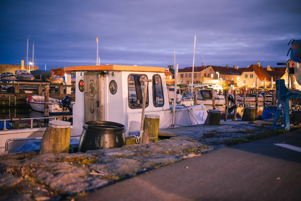 a small boat is docked at a marina