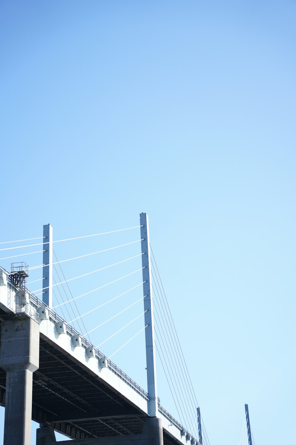 a tall bridge with a sky background