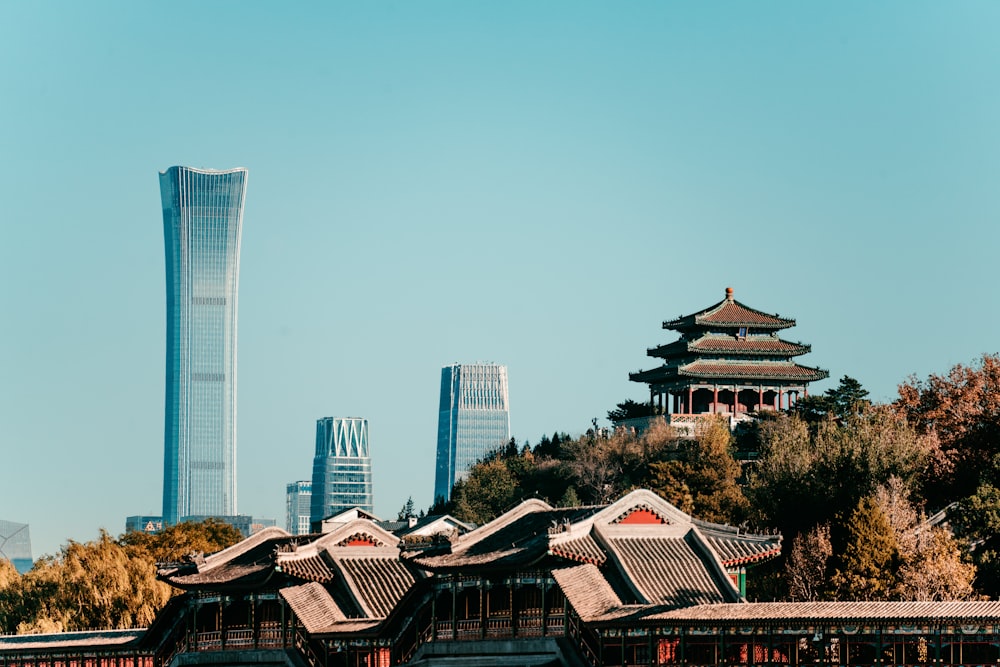 a tall building with a tall tower in the background