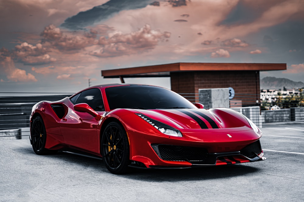 a red sports car parked in a parking lot