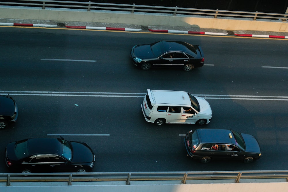 a group of cars that are sitting in the street