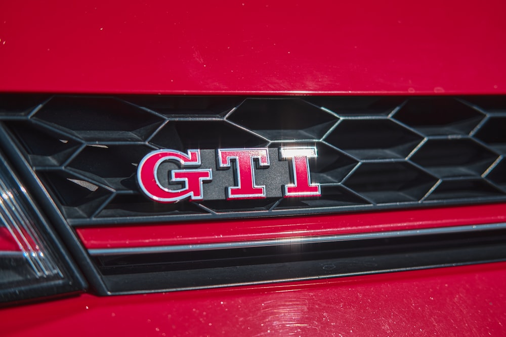 a close up of the front grill of a red car