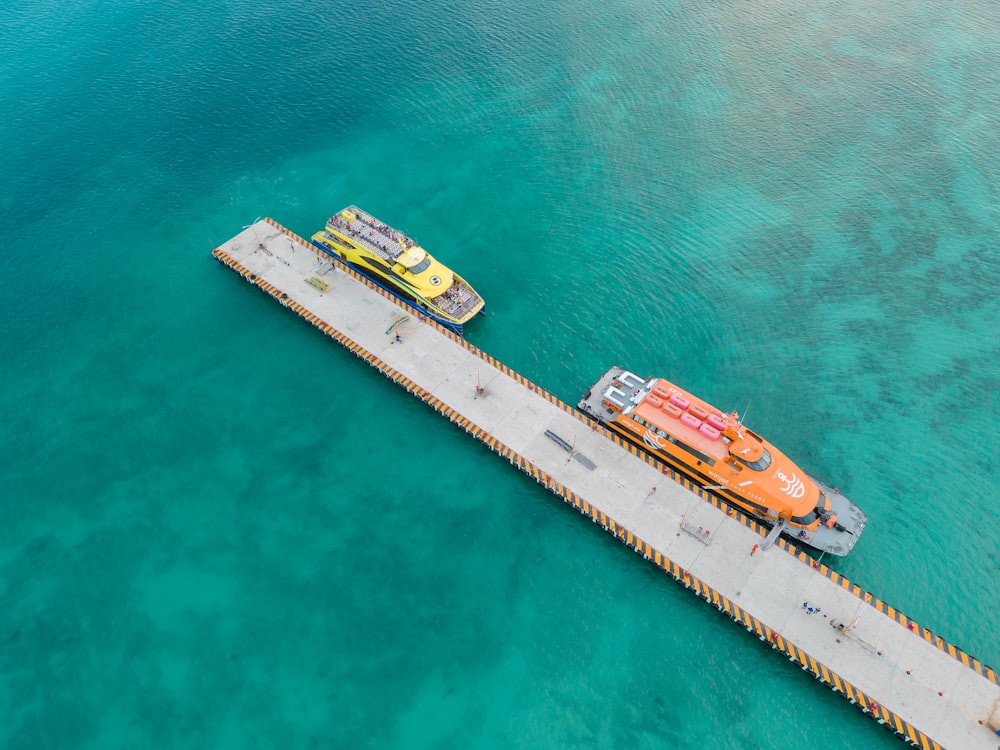 a long dock with two boats on top of it