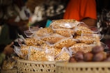 a pile of nuts sitting on top of a basket