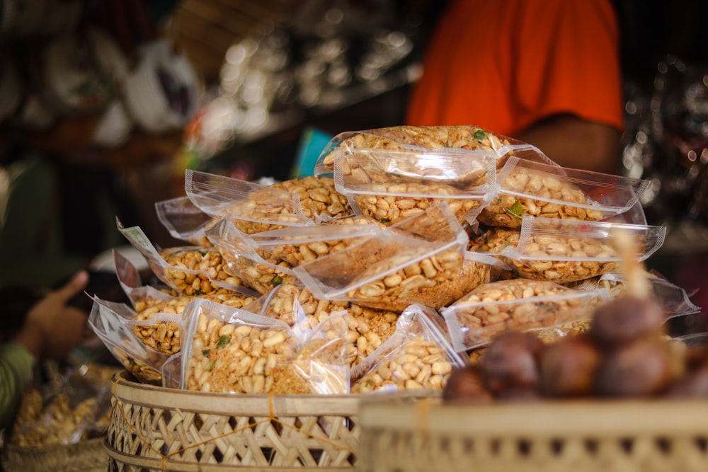 a pile of nuts sitting on top of a basket