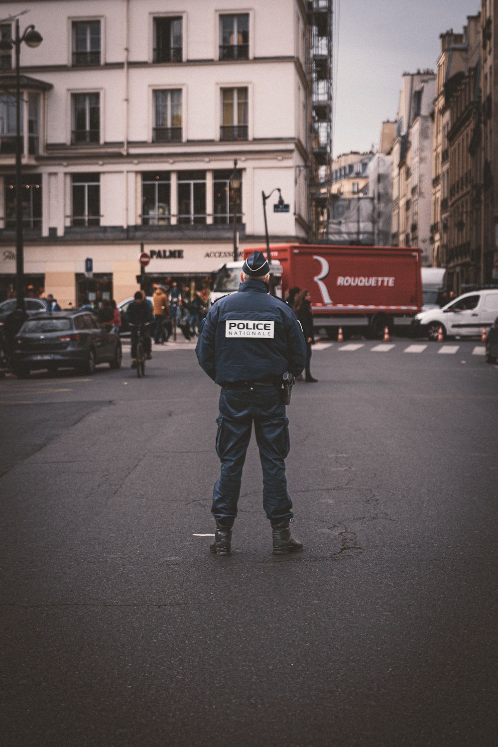 a police officer standing in the middle of a street