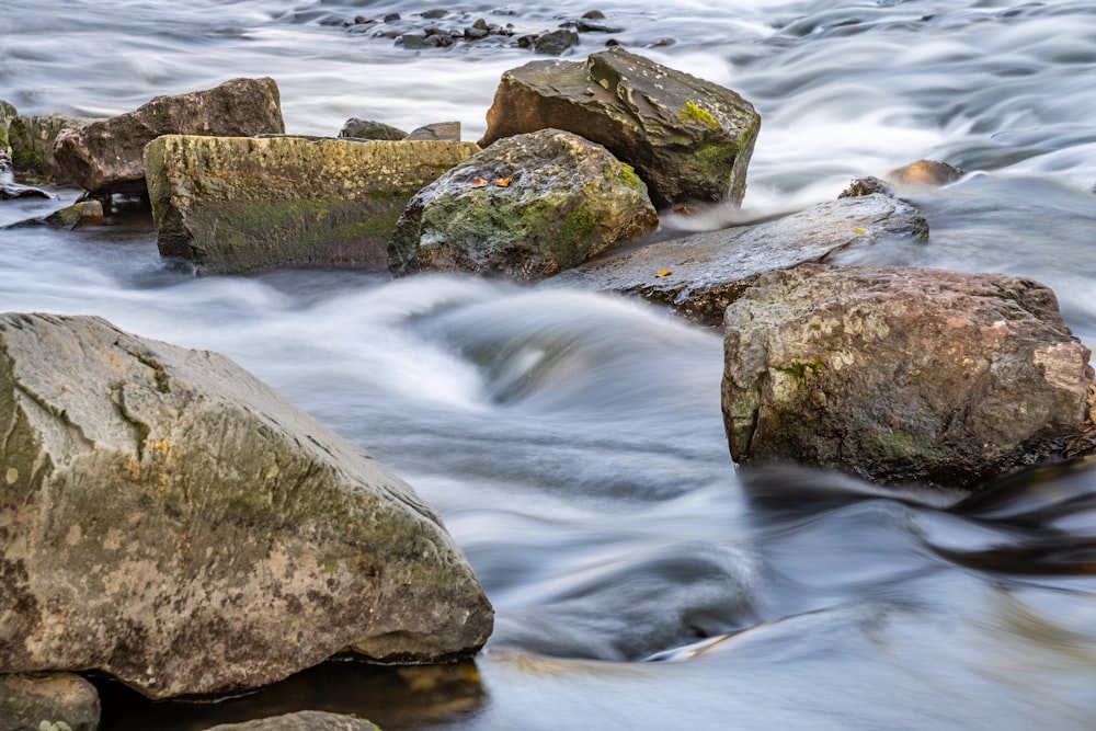 a stream of water with rocks in it