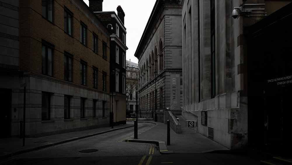 a narrow city street with buildings on both sides