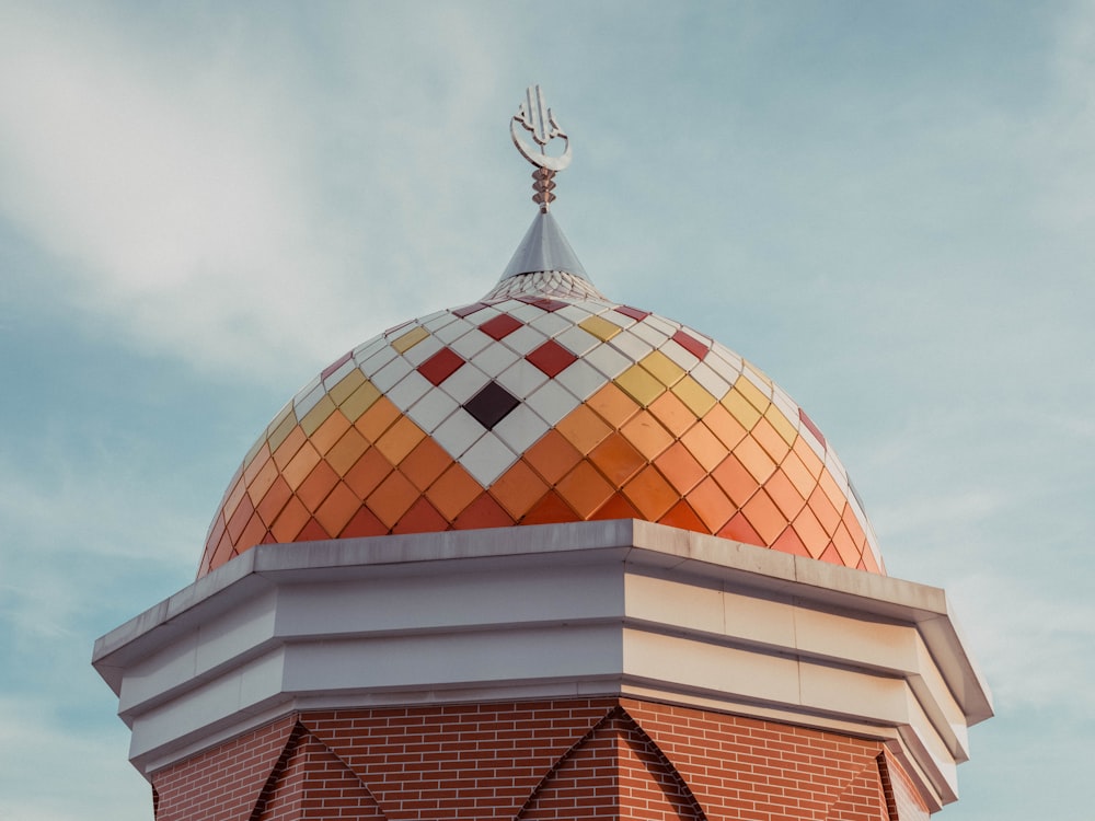 a colorful dome on top of a brick building