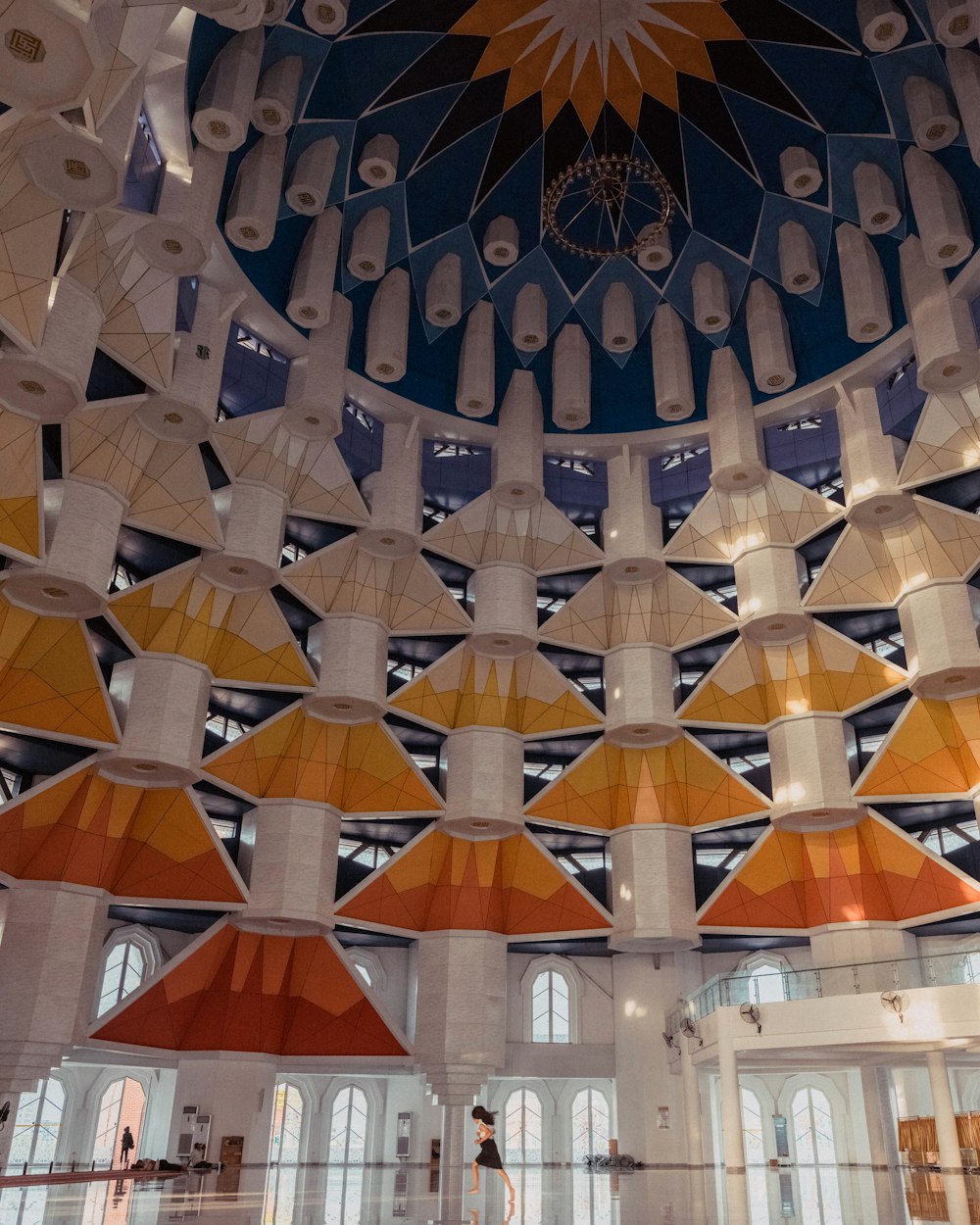 the ceiling of a large building with many lights