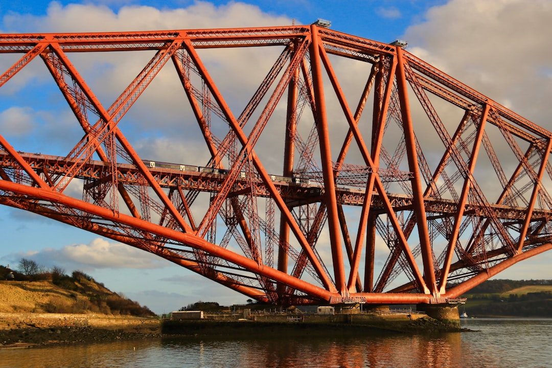 a large red bridge spanning over a body of water, Forth bridge???????