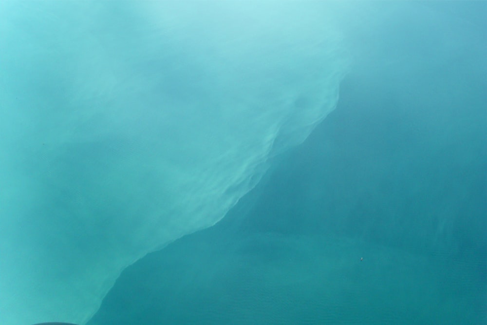 a large body of water with a boat in it