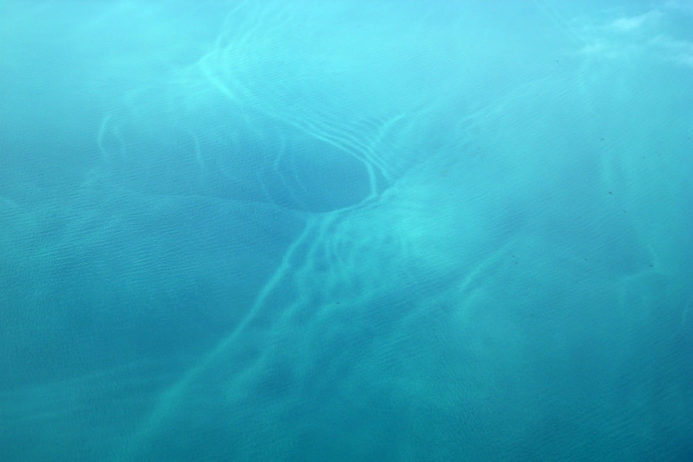 a plane flying over a body of water