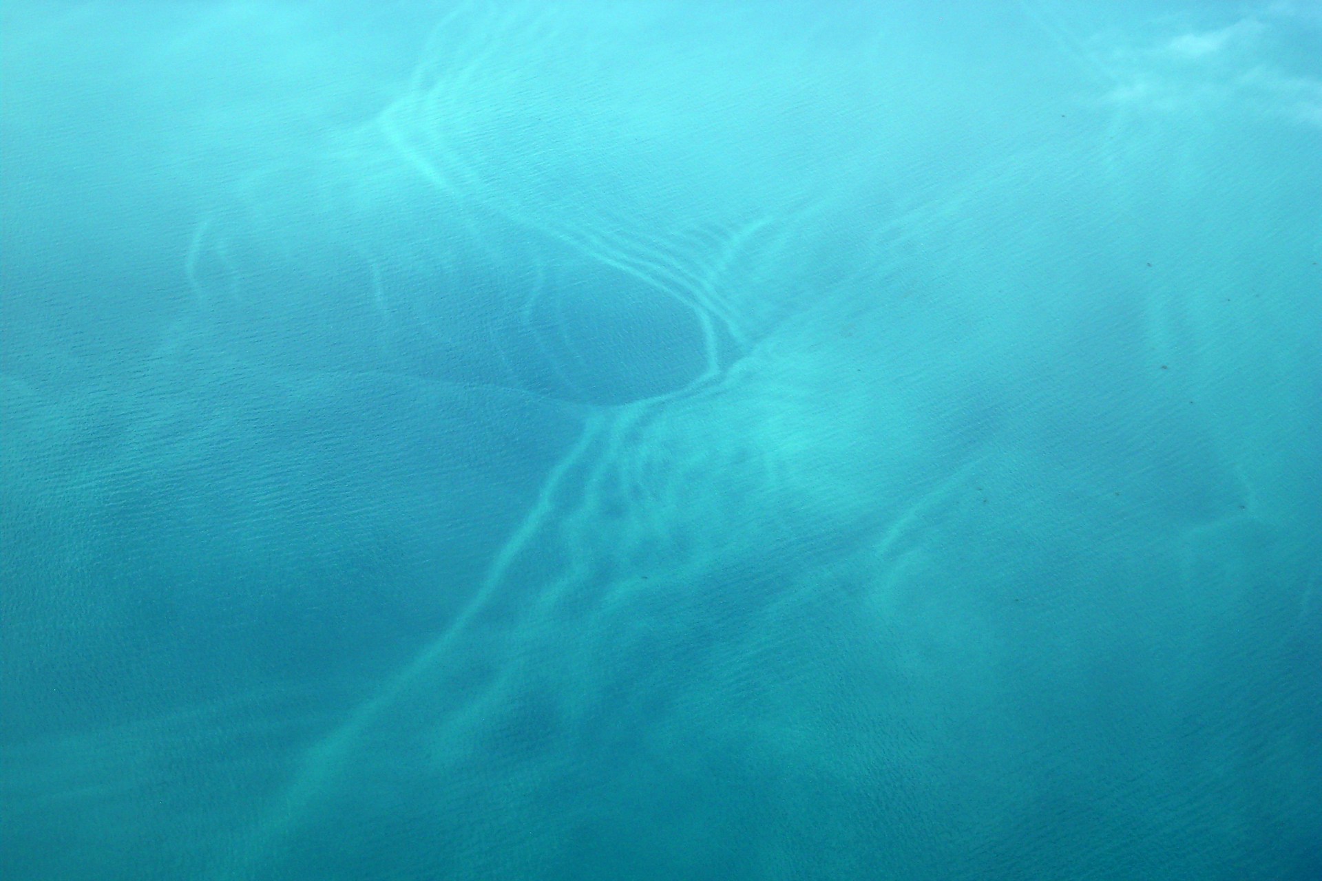 a plane flying over a body of water