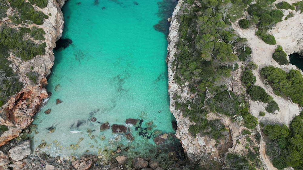 an aerial view of a body of water between two cliffs