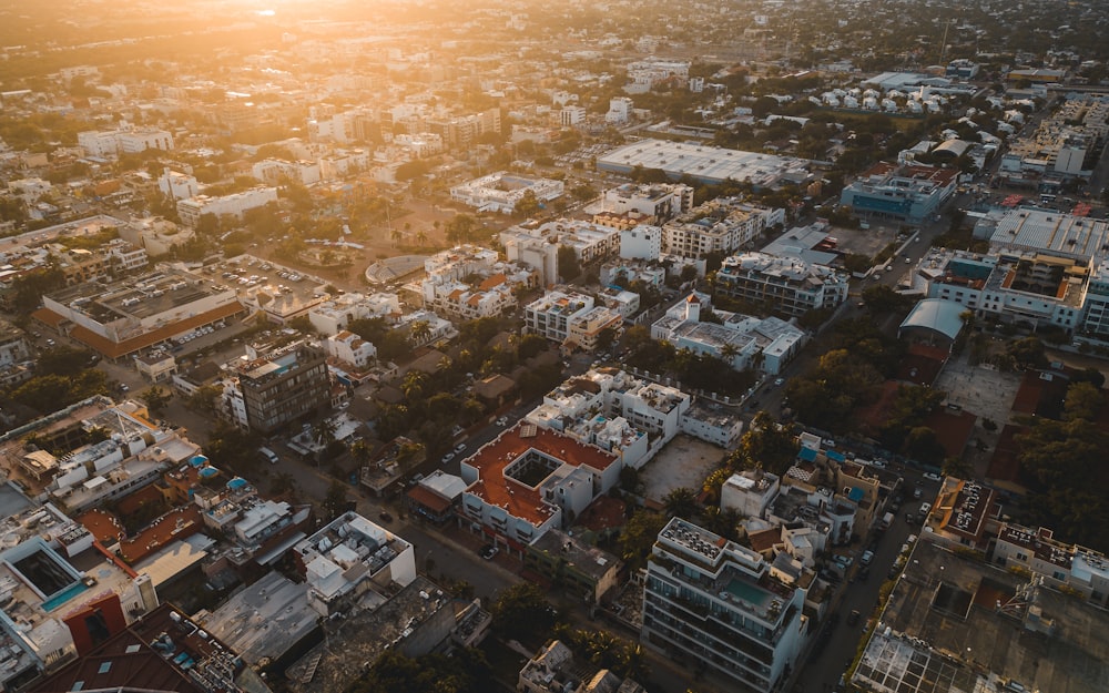 an aerial view of a city at sunset