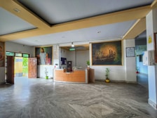 Reception area welcoming guests with traditional Kerala artwork and friendly staff.