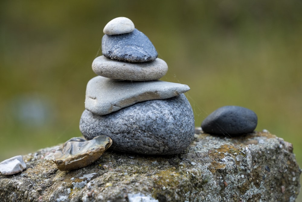 a pile of rocks sitting on top of a rock