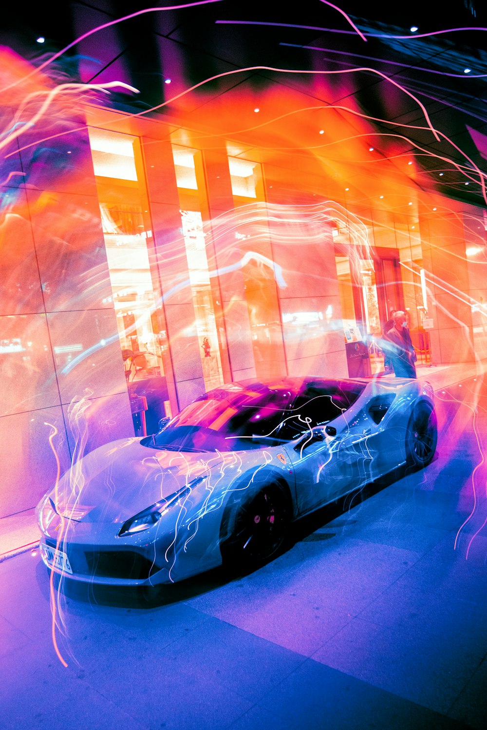a futuristic car is shown in a room with neon lights