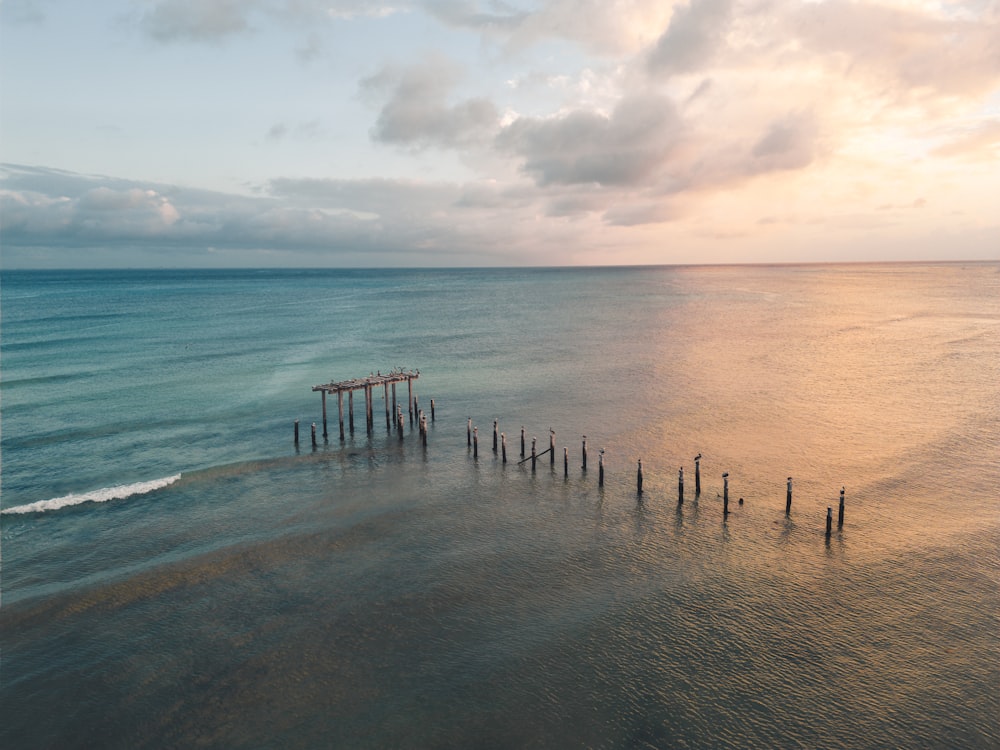 a pier in the middle of a body of water