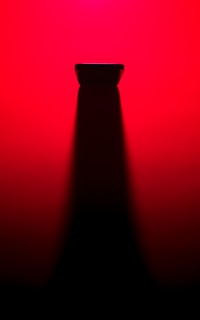 A dynamic angle capturing multiple products with bold shadows on black.