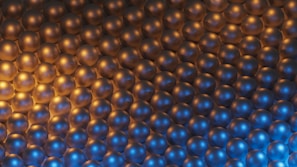 a large group of shiny balls in a room