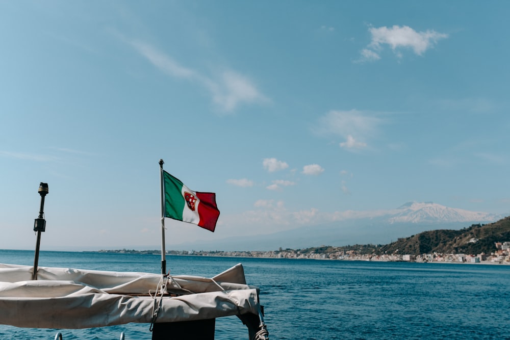 a flag on a boat in the water