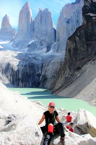 Hikers resting by a crystal-clear mountain lake during a weekend getaway.