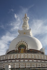a large white building with a cross on top of it