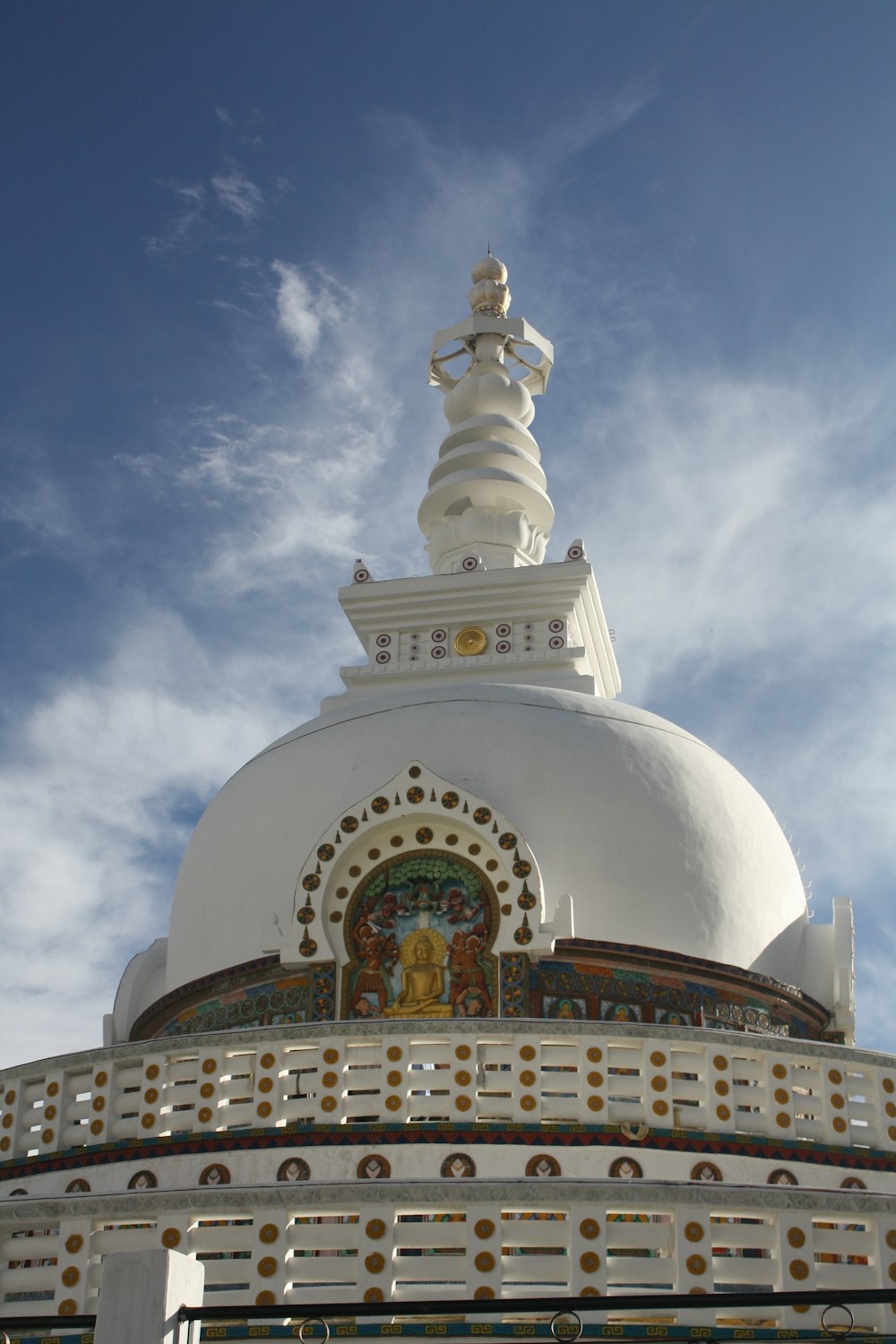 a large white building with a cross on top of it