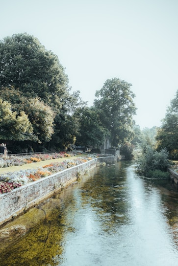 A peaceful wellness center by the flowing Nonquon River surrounded by lush greenery.