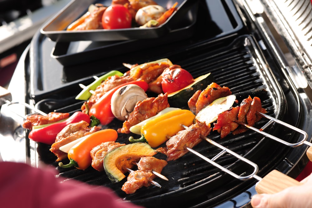 a person is grilling food on a grill