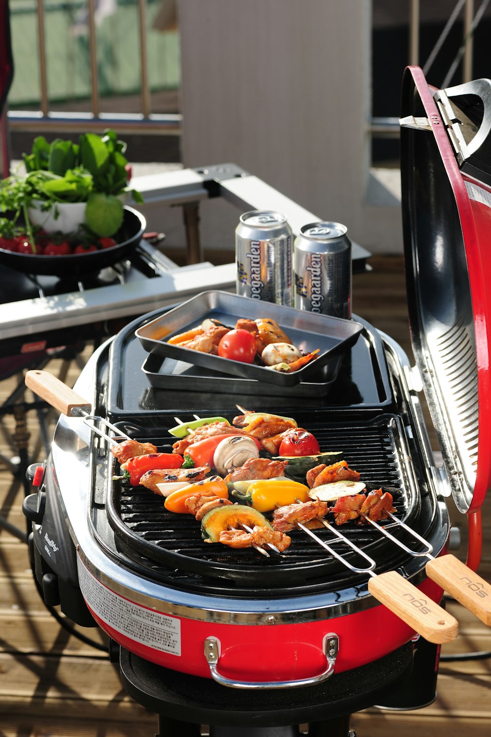 a bbq grill with a variety of food cooking on it