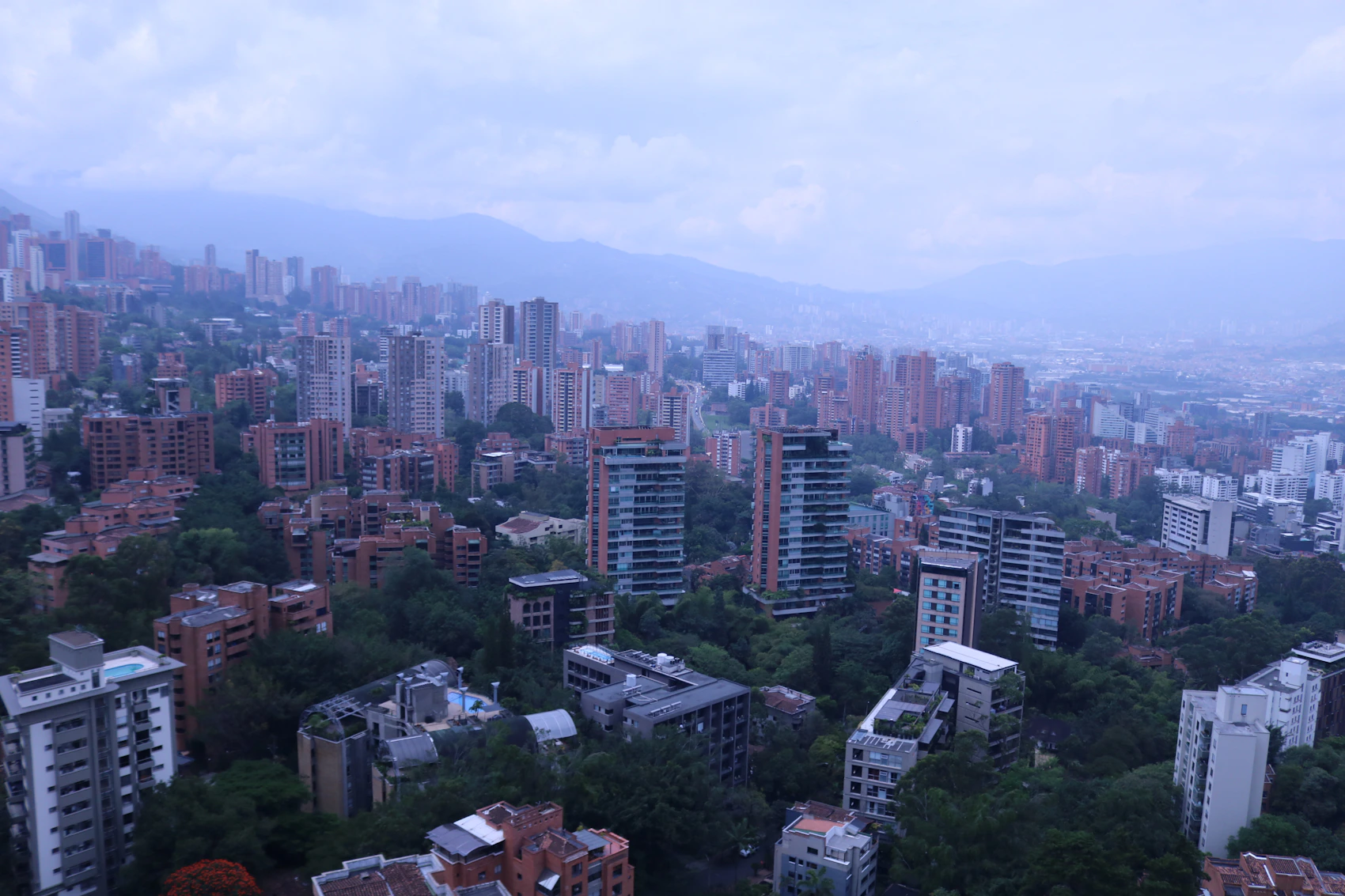 Medellín spreading across its green mountain valley