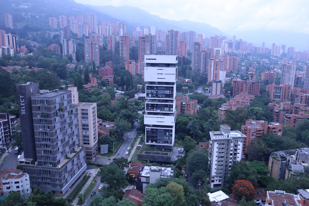 an aerial view of a city with tall buildings