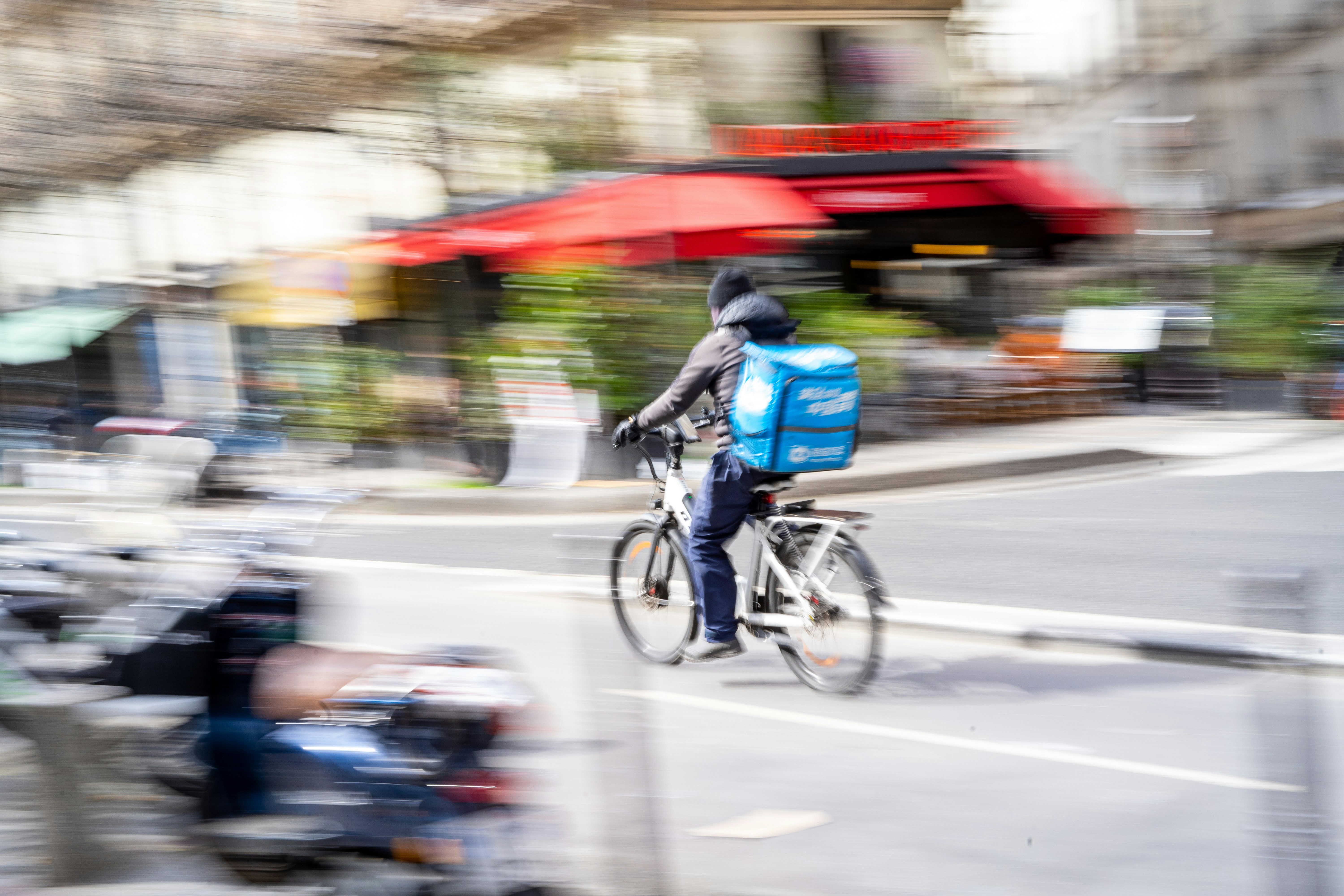 a blurry photo of a person riding a bike